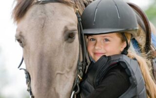 Girl with horse -Summer Riding Camps and Clinics